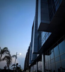 Modern office buildings in the financial district, Architecture details Modern Building Glass facade Business background, Windows of Skyscraper Business Office with blue sky, Corporate building,india