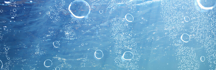 air bubbles underwater blue background, ocean depth diving