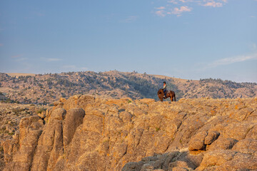Cowgirl in a Cliff