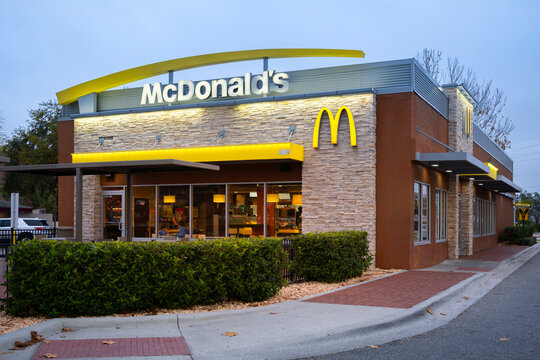 Kissimmee, Florida - February 6, 2022: Night Closeup View of McDonald's Restaurnt Building Exterior.