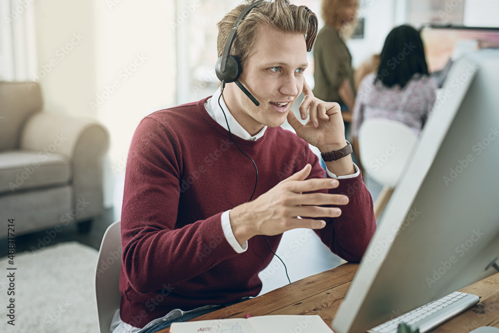 Poster delivering a high quality customer experience with every call. shot of a young man using a headset a