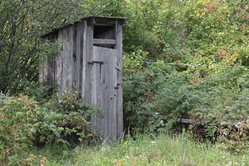 old wooden toilet in the village