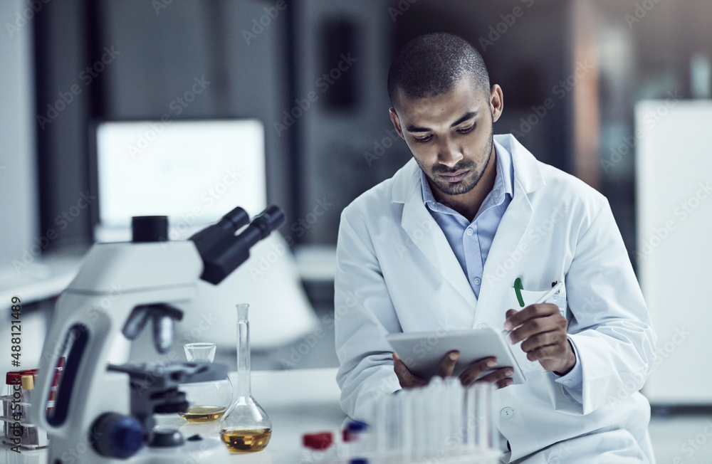 Aufkleber Asking questions and seeking answers. Shot of a scientist recording his findings on a digital tablet.