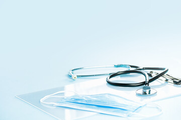 Medical or healthcare concept banner. stethoscope on top of of medical face masks. Doctor appointment or checkups schedule, PPE. Copy space.