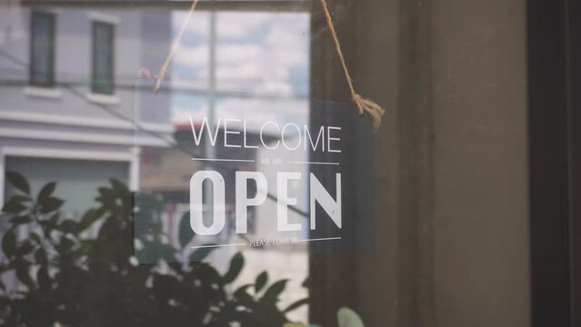 Come in we're open on window of coffee shop, vintage black retro