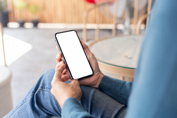 cell phone blank white screen mockup.hand holding texting using mobile on desk at office.background empty space for advertise.work people contact marketing business,technology