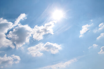 White clouds patterns with the sun on blue sky vast background