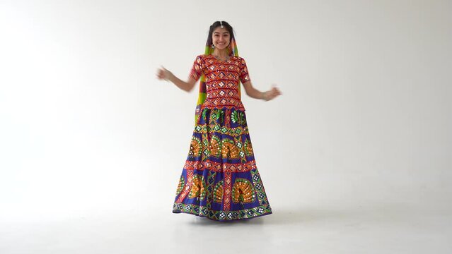 Beautiful indian woman dancing dance at the studio.