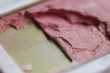 Broken pink eyeshadow and blush palette close-up