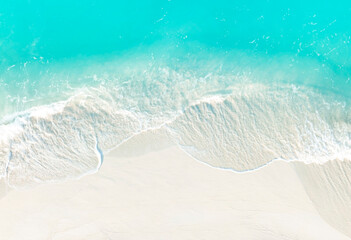 Top view of turquoise color of  wave water background on the summer beach at the seashore and  white  sand beach -Summer pattern image - Powered by Adobe