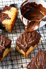 Chocolate marble cake. Slices on tray and wooden table