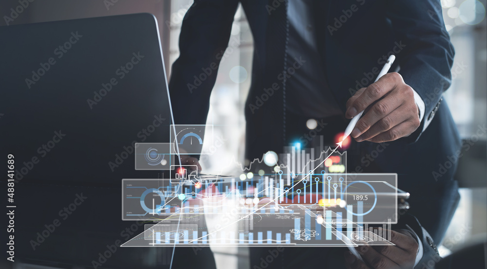 Poster businessman using digital tablet analyzing sales data with financial trading graph and economic grow