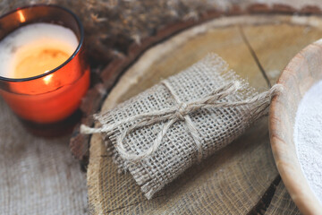 Fototapeta na wymiar Natural handmade soap with candle on a wooden background. SPA relax concept
