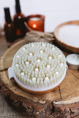Natural beauty care for face and body. Dry massage brush with oils and candles. SPA concept