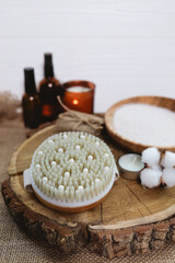 Natural beauty care for face and body. Dry massage brush with oils and candles. SPA concept