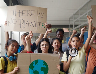 Group of multi-ethnic youth demonstrating against climate change