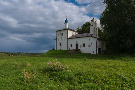 Saint Nicholas Church in Gorodishche  (Nikolskaya church) on Truvorov Gorodishche on a sunny  summer day with clouds. Stary Izborsk, Pskov region, Russia