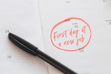 calendar planner with the date highlighted in red the inscription first day on a new job, career...