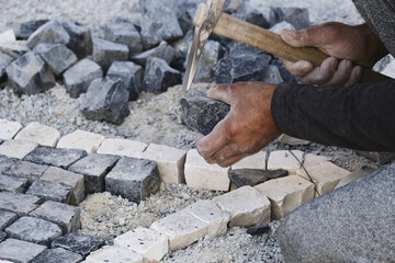repair of a sidewalk with a basalt pavement in Aveiro, Portugal