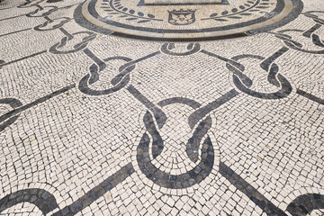 black and white basalt pavement representing rope knots on a sidewalk in Aveiro, Portugal