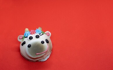 chocolate cookies with cream. red background. cow