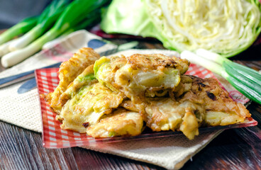 Cabbage fried in batter on a plate.