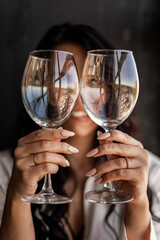 Closeup portrait of happy seductive woman hiding holding wineglass relaxing enjoying weekend