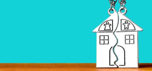 Split house keychains on a turquoise background