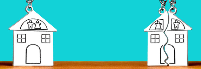 Single and split house shaped keychains on blue