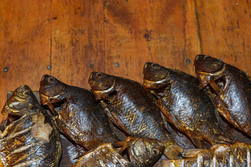 Crucian carp is cooked method by hot smoked. Close-up