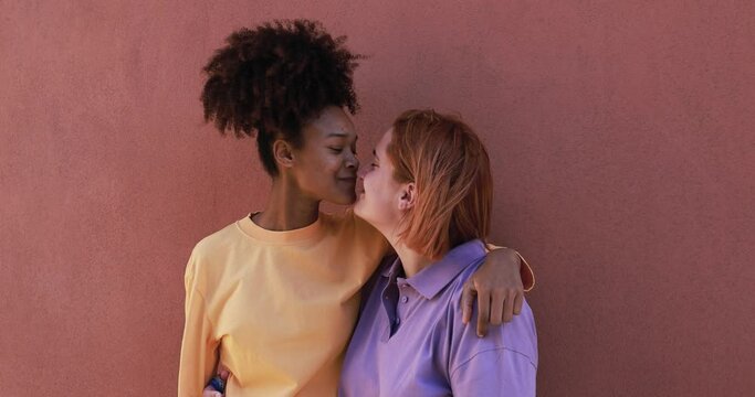 Multiracial gay women couple having tender moment together outdoor - Love and lgbt concept