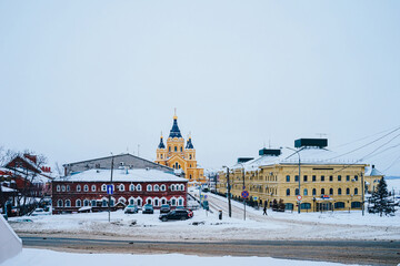 Cathedral in the name of the Holy Prince Alexander Nevsky at Strelka in Nizhny Novgorod. Snow-covered city streets. Former river port area 