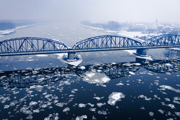 Aerial view of river with floe and bridge above, Bydgoszcz