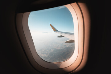 View from the window of the plane on the wing over the beautiful city of Thessaloniki in a haze of...