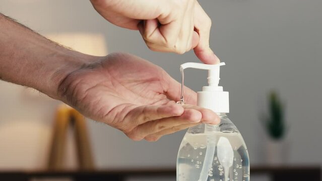 Hand presses sanitizing gel
