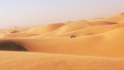 The car drives through the dunes of Sandwich Harbor. Namibia