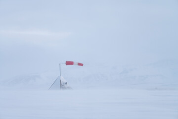 Airfield windsock in driving snow, Northern Iceland