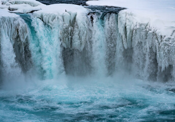 Godafoss Waterfall, Iceland partially frozen in winter