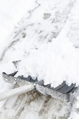 Snow cleaning with a large shovel in winter - 488169206