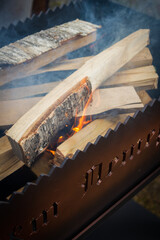 Dry wood in the grill for kindling and making coals - 488169830