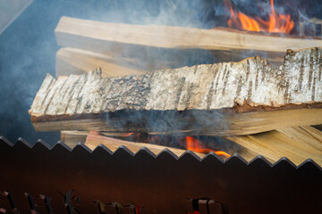 Dry wood in the grill for kindling and making coals - 488169855