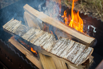 Dry wood in the grill for kindling and making coals - 488169859