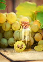 Grape seed oil in a bottle. Selective focus.