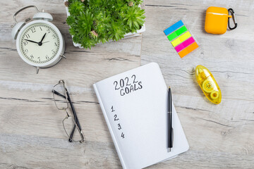 Copy space for 2022 Goals in notebook plan listing of new year goals