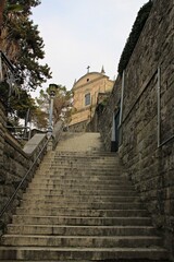 Fototapeta na wymiar Italy, Veneto, Malcesine: Staircase of the Church of Saint Stefano.
