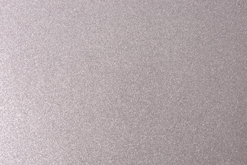 Fototapeta na wymiar Silver, shiny and glittering surface. Abstract background. Events, celebrations. Trendy backdrop for your design. Texture with glitter.