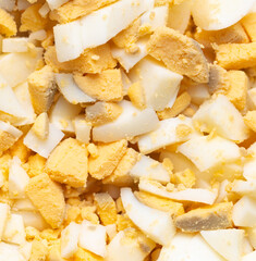 Sliced boiled eggs as a background.