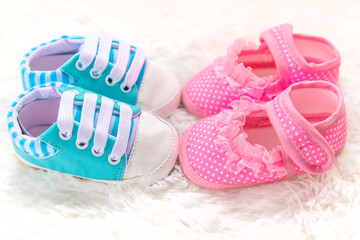 Baby booties accessories on a white background.
