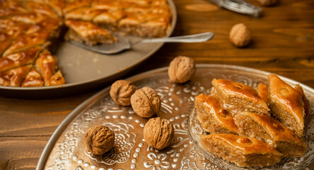 Baklava with nuts on a wooden background. Selective focus.
