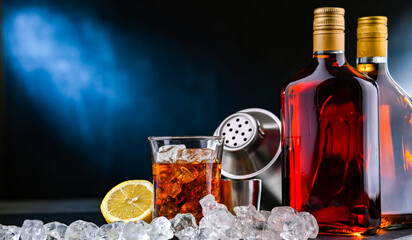 Composition with an alcoholic drink and a cocktail shaker